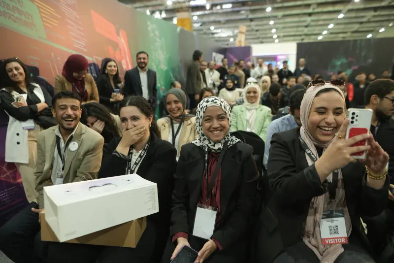 Excited audience members react and film during a Cyber Zone prize draw, Connecta 2025