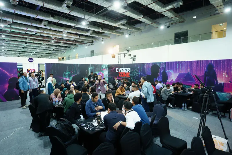 Wide view of the busy Cyber Zone with teams and spectators, Connecta 2025