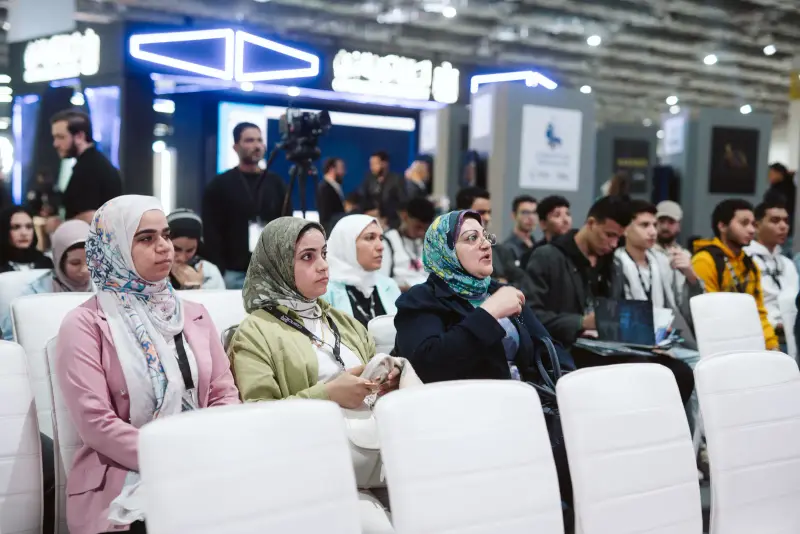 Rows of attendees listening closely during an Innovation Arena talk, Connecta 2025