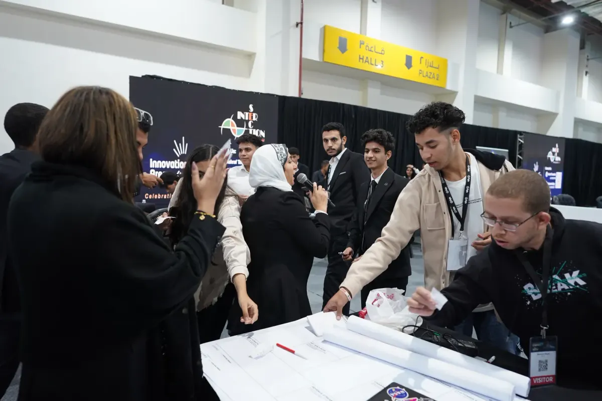Hackathon participants brainstorming over large sheets of paper, Connecta 2025