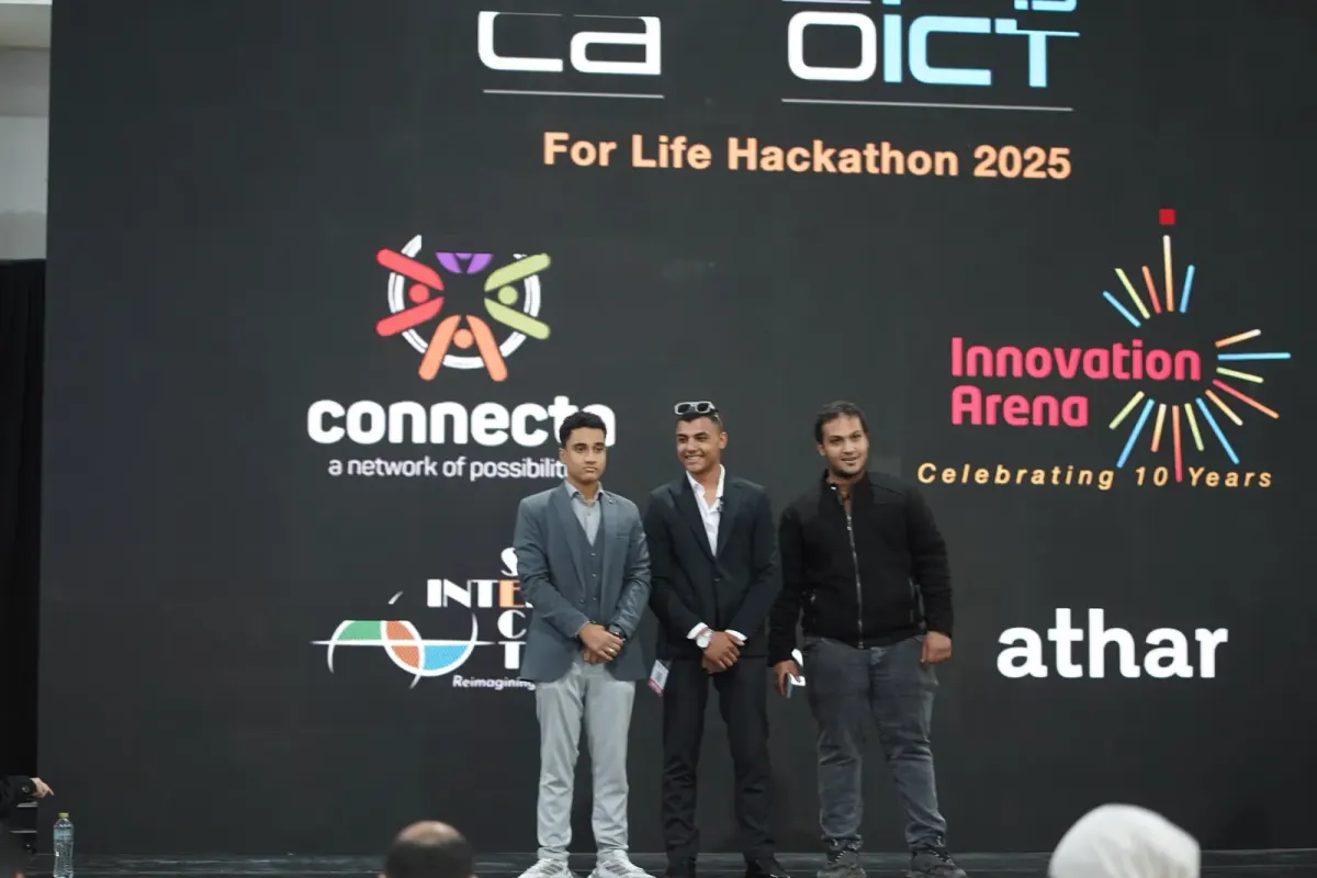 Team pitching on the AI For Life Hackathon stage with Connecta branding, Connecta 2025