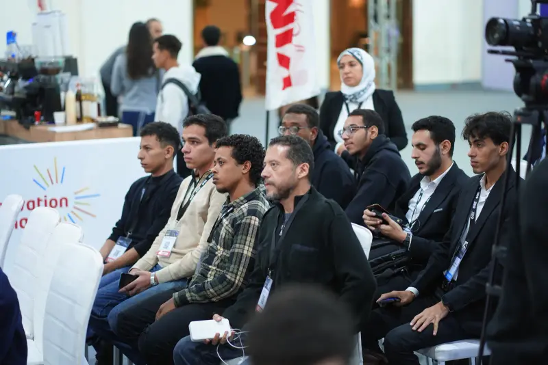 Hackathon teams seated together waiting for their turn to pitch, Connecta 2025