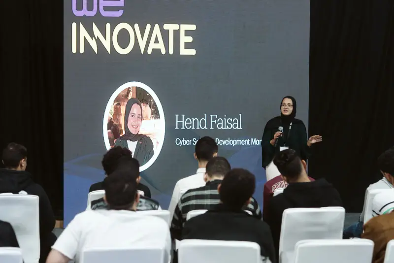 Speaker presenting at a We Innovate session before a seated audience, Connecta 2025